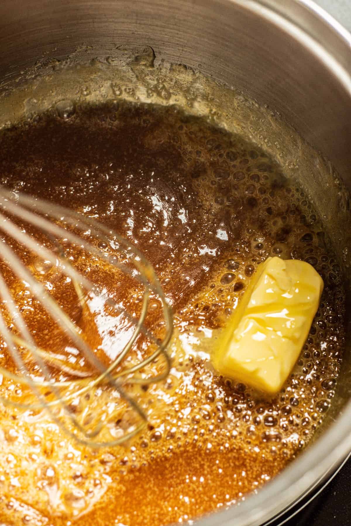 butter cube in a hot caramel sauce.